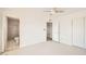 Bright bedroom with white walls, modern ceiling fan, and access to the renovated bathroom at 726 N 78Th St, Scottsdale, AZ 85257