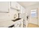 Laundry room featuring modern washer, dryer, quartz counters, and new fixtures at 726 N 78Th St, Scottsdale, AZ 85257
