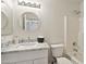 Bright bathroom featuring a marble countertop vanity and shower-tub combo at 7500 E Deer Valley Rd # 132, Scottsdale, AZ 85255