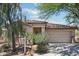 Inviting home with a tile roof, two-car garage, and desert landscaping at 7500 E Deer Valley Rd # 132, Scottsdale, AZ 85255
