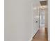 Hallway with wood floors, recessed lighting, and white walls with an airy feel at 7500 E Deer Valley Rd # 132, Scottsdale, AZ 85255