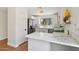Well-lit kitchen with marble countertops and modern stainless steel appliances at 7500 E Deer Valley Rd # 132, Scottsdale, AZ 85255