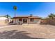 Large backyard with gravel, patio area, shed, and block wall fence at 815 W El Prado Rd, Chandler, AZ 85225