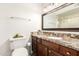 Bathroom features granite countertops, updated vanity, and a framed mirror at 815 W El Prado Rd, Chandler, AZ 85225
