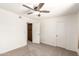 Bright bedroom features a ceiling fan, carpet, and a neutral color palette at 815 W El Prado Rd, Chandler, AZ 85225
