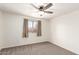 Bedroom features neutral carpet and a ceiling fan at 815 W El Prado Rd, Chandler, AZ 85225