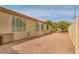 The backyard area with beige stucco walls, plenty of space for landscape design and outdoor enjoyment at 8210 W Wethersfield Rd, Peoria, AZ 85381