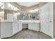 Spacious bathroom with double vanities and abundant mirror space and cabinets at 8210 W Wethersfield Rd, Peoria, AZ 85381