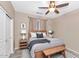 Bedroom with King bed, ceiling fan, and neutral color pallet at 8210 W Wethersfield Rd, Peoria, AZ 85381