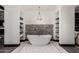 Relaxing bathroom with a standalone tub, mosaic tile floor, and recessed shelving for toiletries at 8555 E Tecolote Cir, Scottsdale, AZ 85266