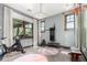 Exercise room featuring hardwood floors, workout equipment and ample sunlight at 8555 E Tecolote Cir, Scottsdale, AZ 85266