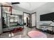 Bright exercise room with large mirror and a variety of exercise equipment, plus view to outdoor landscape at 8555 E Tecolote Cir, Scottsdale, AZ 85266