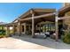 Expansive covered patio with outdoor seating and dining areas, perfect for entertaining or relaxing at 8555 E Tecolote Cir, Scottsdale, AZ 85266