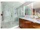 Bathroom with marble shower, modern vanity, and luxurious finishes at 9502 N 47Th St, Phoenix, AZ 85028