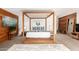 Bright bedroom with a four-poster bed, wood accents, and contemporary design at 9502 N 47Th St, Phoenix, AZ 85028