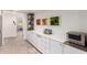 Contemporary kitchen with white cabinets, stainless steel appliances, and ample counter space at 9502 N 47Th St, Phoenix, AZ 85028