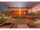 Inviting outdoor dining area with pergola, curtains, barbecue, and stunning mountain views, perfect for entertaining guests at 9502 N 47Th St, Phoenix, AZ 85028