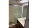 Bathroom featuring a frosted glass shower door, tiled walls, and vanity with a sink at 973 Leisure World --, Mesa, AZ 85206