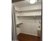 Walk-in closet with ample shelving, clothing rods, and a neutral color palette at 973 Leisure World --, Mesa, AZ 85206