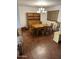 Bright dining room with hardwood floors, a classic wooden hutch, and a chandelier at 973 Leisure World --, Mesa, AZ 85206