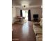 Comfortable living room area with a ceiling fan and sliding glass door leading to the outside at 973 Leisure World --, Mesa, AZ 85206