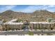 Scenic aerial view of the apartment complex with mountain views in the background in a charming city neighborhood at 9820 N Central Ave # 303, Phoenix, AZ 85020