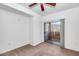 Cozy bedroom featuring plush carpet, a ceiling fan, and sliding glass doors at 9820 N Central Ave # 303, Phoenix, AZ 85020