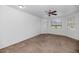 Bright bedroom featuring neutral carpet and a tranquil view at 9820 N Central Ave # 303, Phoenix, AZ 85020