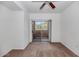 Bedroom with carpet, ceiling fan, and glass door to balcony with desert views at 9820 N Central Ave # 303, Phoenix, AZ 85020