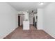 Bright living room featuring plush carpet, fresh paint, and an open layout to the kitchen at 9820 N Central Ave # 303, Phoenix, AZ 85020