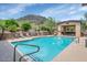 Inviting community pool with scenic mountain views and convenient lounge chairs at 9820 N Central Ave # 303, Phoenix, AZ 85020