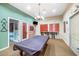 Inviting recreation room with a billiards table, TV, and comfortable seating at 9820 N Central Ave # 303, Phoenix, AZ 85020