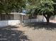 Inviting front yard with desert landscaping and mature shade tree enhancing curb appeal at 10728 W El Rancho Dr, Sun City, AZ 85351