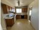 Well-lit kitchen with ample cabinet space, standard appliances, and convenient layout at 10728 W El Rancho Dr, Sun City, AZ 85351