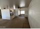 Spacious living room featuring an open layout, ceiling fan, and abundant natural light at 10728 W El Rancho Dr, Sun City, AZ 85351