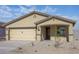 Inviting single-story home features a well-maintained front yard and a two-car garage at 1131 W West Virginia Ave, Florence, AZ 85132