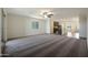 Spacious living room with neutral carpet, ceiling fan, and views into the kitchen at 1131 W West Virginia Ave, Florence, AZ 85132