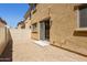 Small gravel backyard with a beige privacy fence and sliding glass door at 1367 S Country Club Dr # 1167, Mesa, AZ 85210