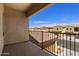 A balcony with a view of the neighborhood featuring multi-story townhomes on a sunny day at 1367 S Country Club Dr # 1167, Mesa, AZ 85210