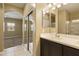 Bathroom view featuring a double vanity and a sliding door walk-in closet at 1367 S Country Club Dr # 1167, Mesa, AZ 85210