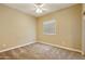Empty bedroom featuring neutral carpet, a ceiling fan, and a window at 1367 S Country Club Dr # 1167, Mesa, AZ 85210