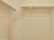 A functional walk-in closet with ample hanging space and a minimalist design at 1367 S Country Club Dr # 1167, Mesa, AZ 85210