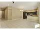 Open living room area with tile floors and dining area adjacent to the kitchen at 1367 S Country Club Dr # 1167, Mesa, AZ 85210