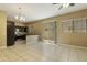 Open living room area with tile floors next to the kitchen at 1367 S Country Club Dr # 1167, Mesa, AZ 85210