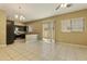 Open living room area with tile floors next to the kitchen at 1367 S Country Club Dr # 1167, Mesa, AZ 85210