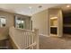 Upstairs loft featuring neutral carpet, a sliding glass door, and access to the bathroom at 1367 S Country Club Dr # 1167, Mesa, AZ 85210
