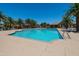 Community pool offers a refreshing oasis for residents with well-maintained landscaping, chairs and sunning decks at 1367 S Country Club Dr # 1167, Mesa, AZ 85210