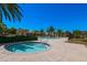 A pool and spa in a community with desert landscaping, palm trees and neutral stucco buildings at 1367 S Country Club Dr # 1167, Mesa, AZ 85210