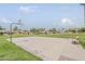 Community basketball court ready for a game; landscaping and community homes can be seen in the background at 1391 W Windhaven Ave, Gilbert, AZ 85233