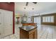Expansive kitchen boasts a large island, sleek countertops, and tile flooring, perfect for culinary creations at 1391 W Windhaven Ave, Gilbert, AZ 85233
